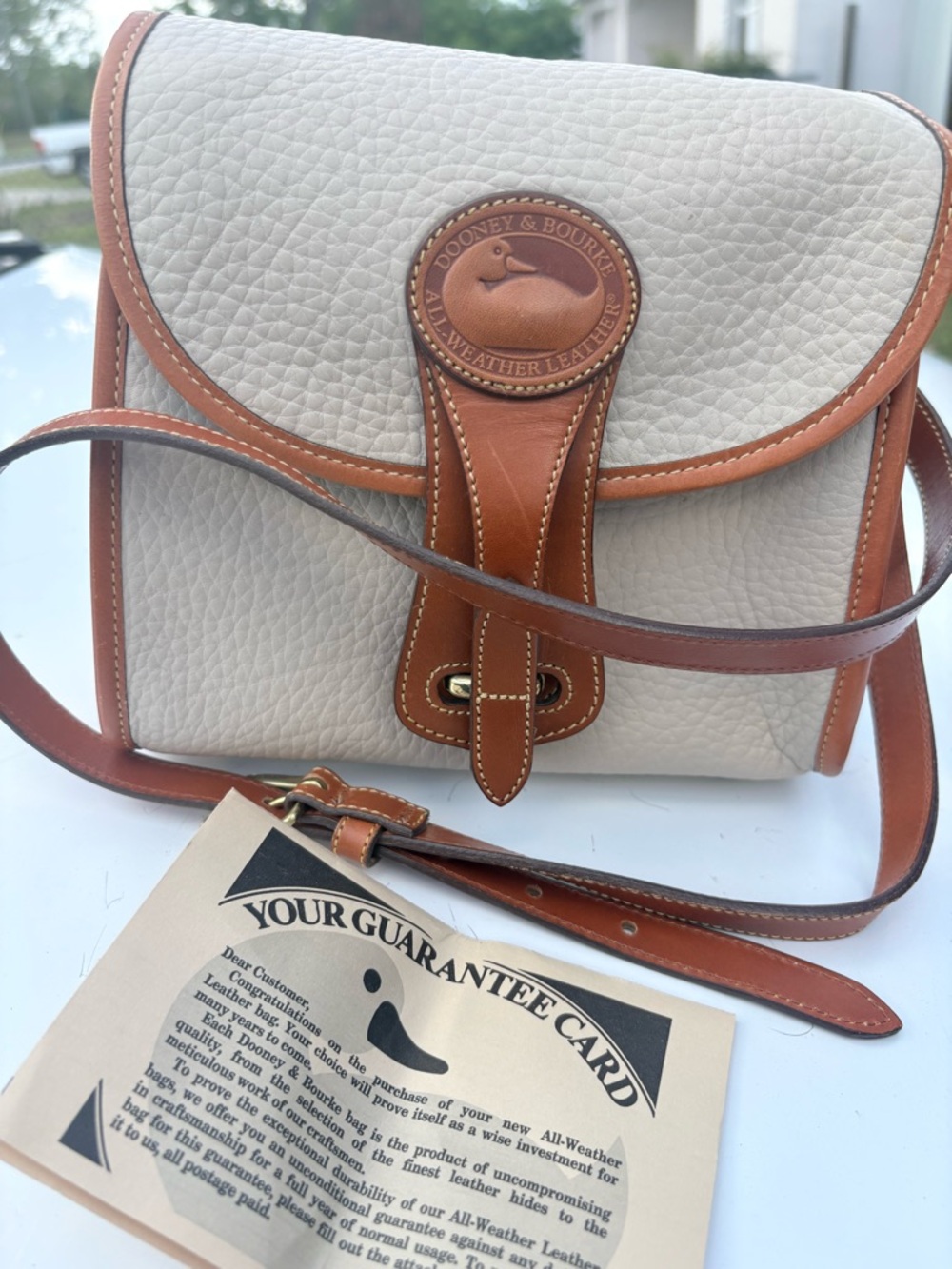 Dooney & Bourke Cream & Brown Pebbled Leather Crossbody Bag